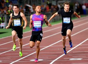 (L-R) Italy's Filippo Tortu, Canada's Andre de Grasse and France's Christophe Lemaitre compete in the men's 200m event at the Rome meeting of the IAAF Diamond League athletics competition at the Olympic Stadium in Rome on June 8, 2017. / AFP PHOTO / ALBERTO PIZZOLI